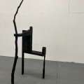 A World Held Up, reclaimed wood, tree branch, black spray paint, 2026, 1