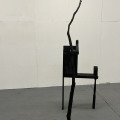 A World Held Up, reclaimed wood, tree branch, black spray paint, 2026, 2