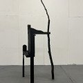 A World Held Up, reclaimed wood, tree branch, black spray paint, 2026, 6