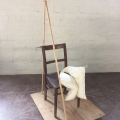 Are You sitting comfortably?, wood, chair, g-clamp, pillow, bronze light bulb, 2020.